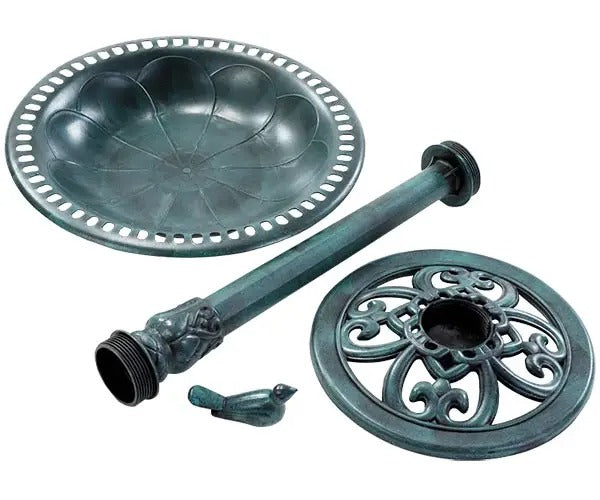 A set of outdoor garden furniture pieces in a dark green weathered metal finish, including a round tray with a perforated rim, a cylindrical post, a decorative circular base plate, and a small bird-shaped accent piece, all shown on a white background.